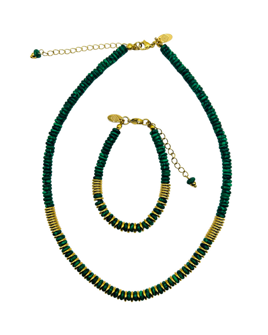 Green beaded necklace and bracelet set on a white background. Geena Set necklace and bracelet in green malachite-style beads with gold accents on white background.