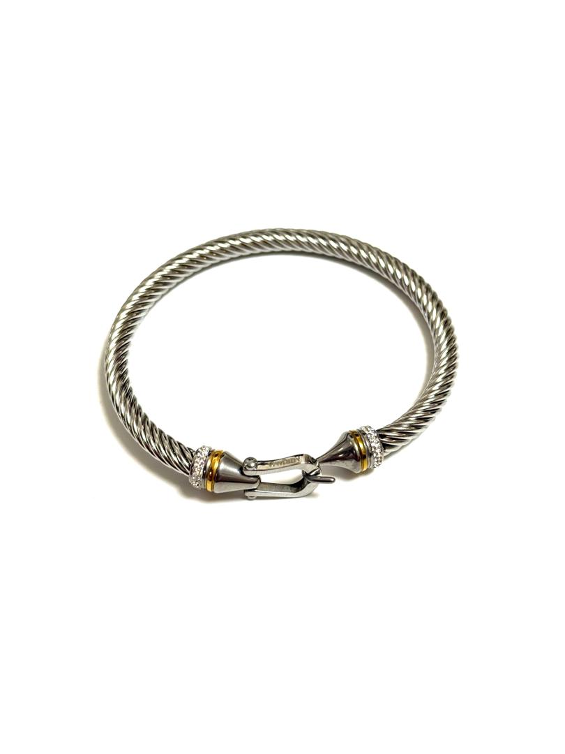 An 18k gold-plated classic cable cuff bangle bracelet with sparkling diamond accents and a fishhook clasp.