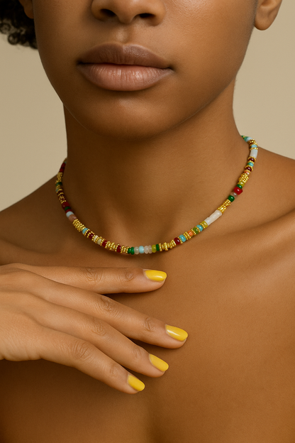 Close-up of a women wearing a colorful beaded necklace. Close-up of Bella Set matching bracelet with adjustable gold extender chain.