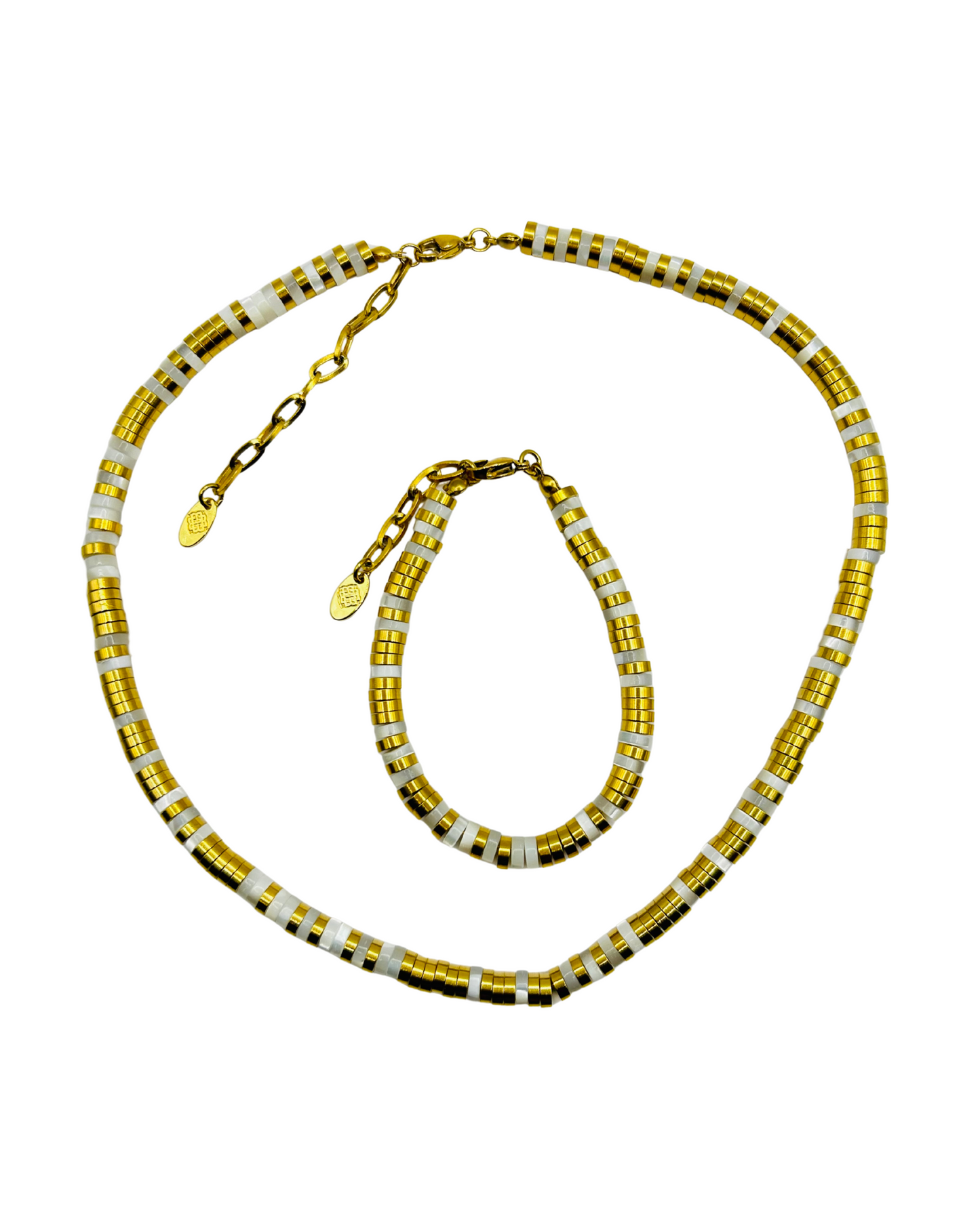 Gold and silver beaded necklace on a white background
