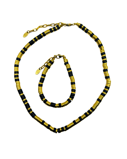 Female Eona Black Set gold and black beaded necklace and bracelet flat lay on white background