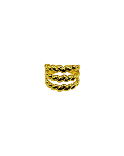 Goldtwisted ring on a white background
