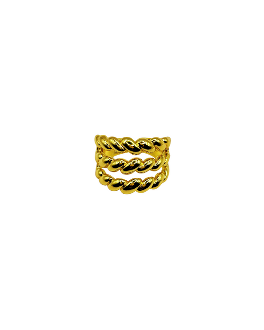 Goldtwisted ring on a white background