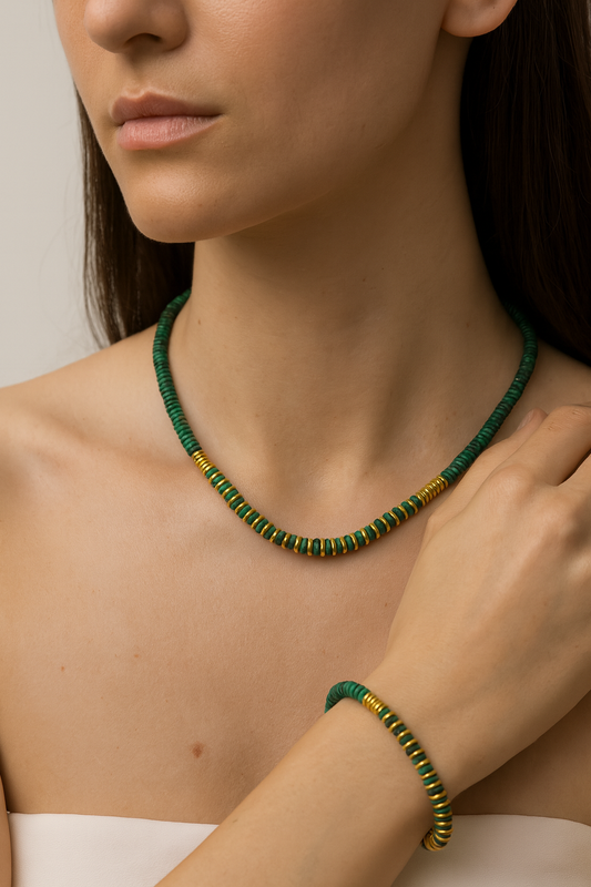 Geena Set necklace and bracelet in green malachite-style beads with gold accents on a model