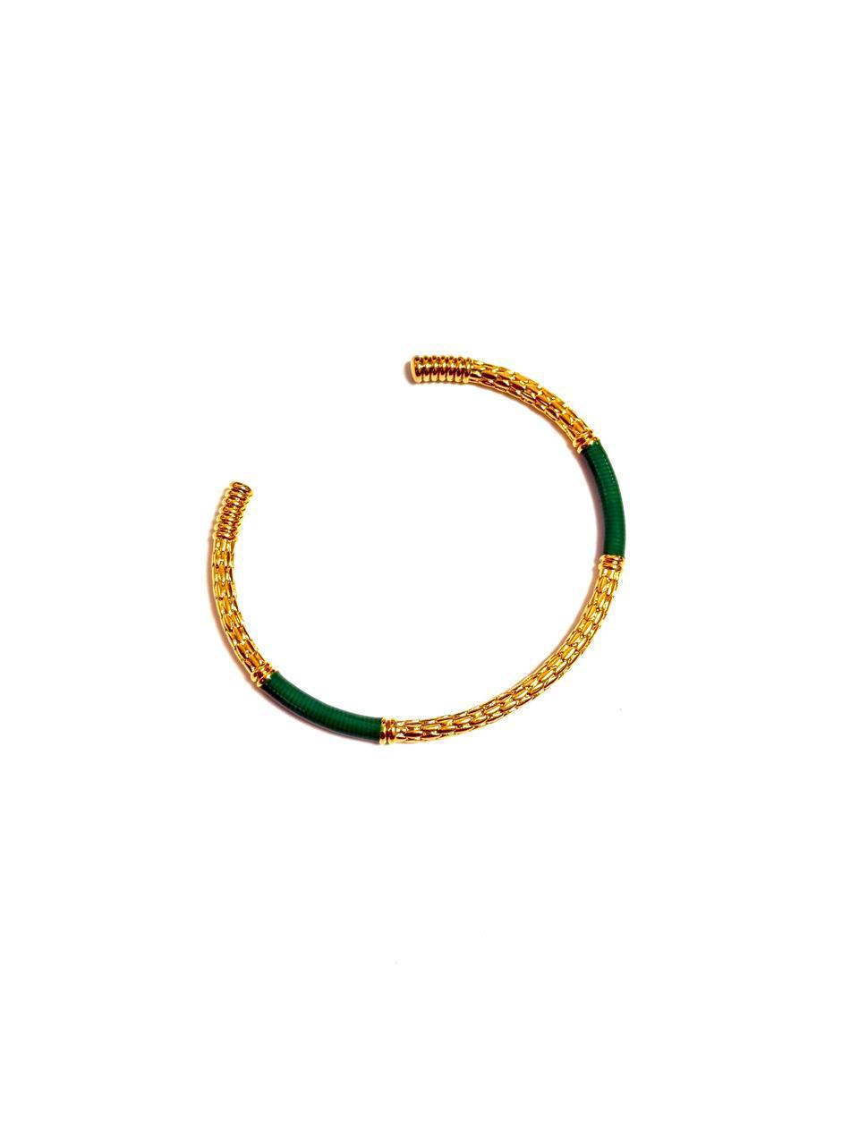 An 18k gold-plated c-shaped cuff bangle bracelet with gold-tone metalwork and multicolored enamel detailing.