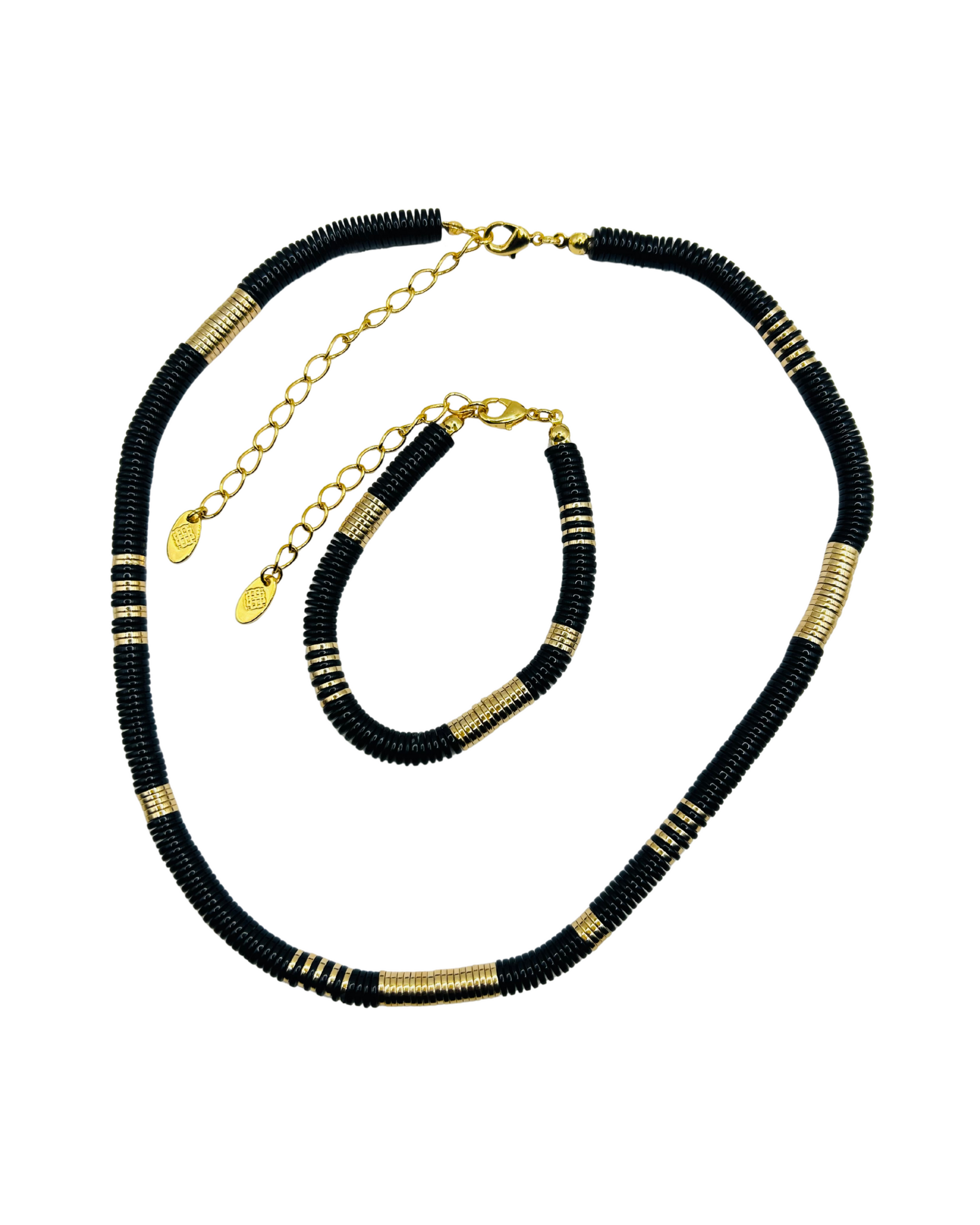 Black and gold beaded necklace on a white background