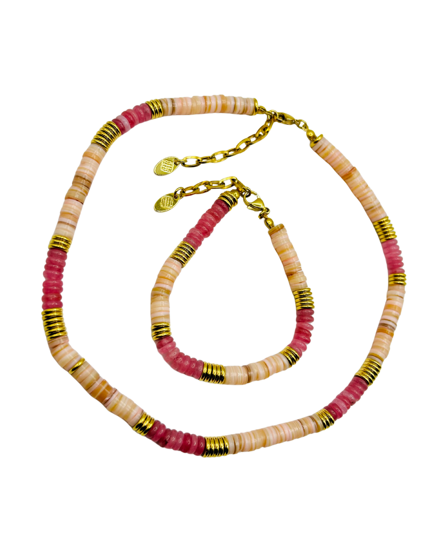 Necklace with pink, beige, and gold beads on a white background