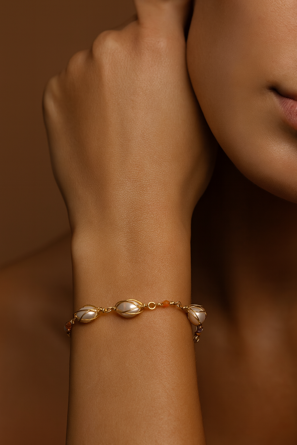 Gold wire-wrapped baroque pearl bracelet. Tania Set close-up showing freshwater pearls, gold wire cage design, and bead accents