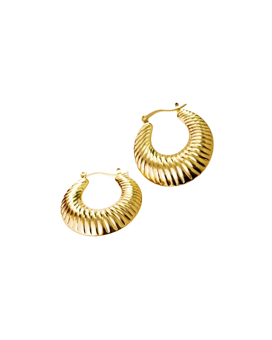 Thea Earring Pair of gold hoop earrings on a white background
