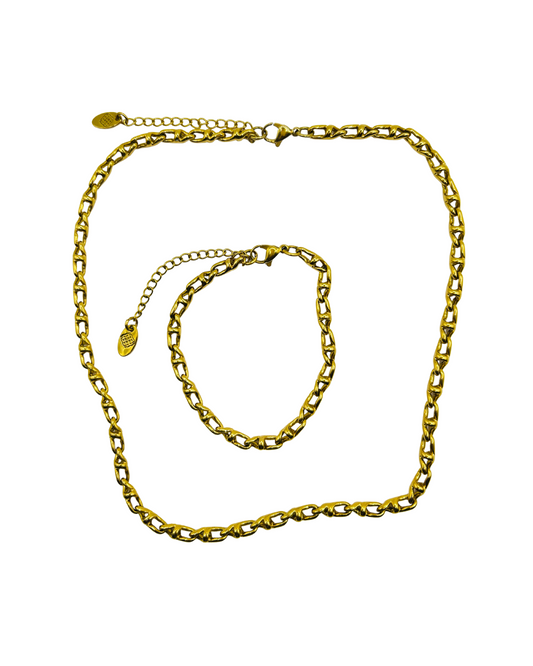 Gold chain necklace and bracelet on a white background