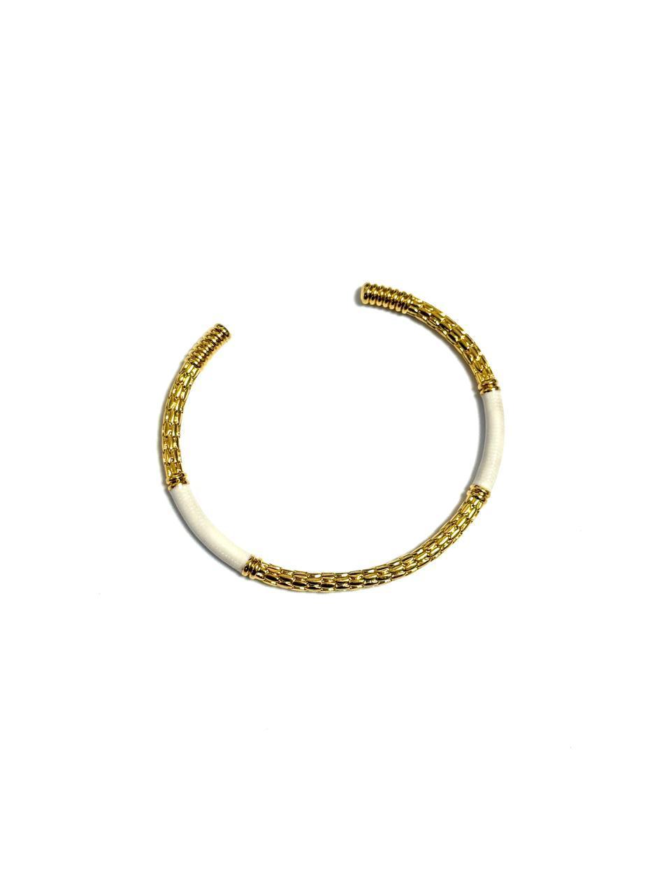 An 18k gold-plated c-shaped cuff bangle bracelet with gold-tone metalwork and multicolored enamel detailing.
