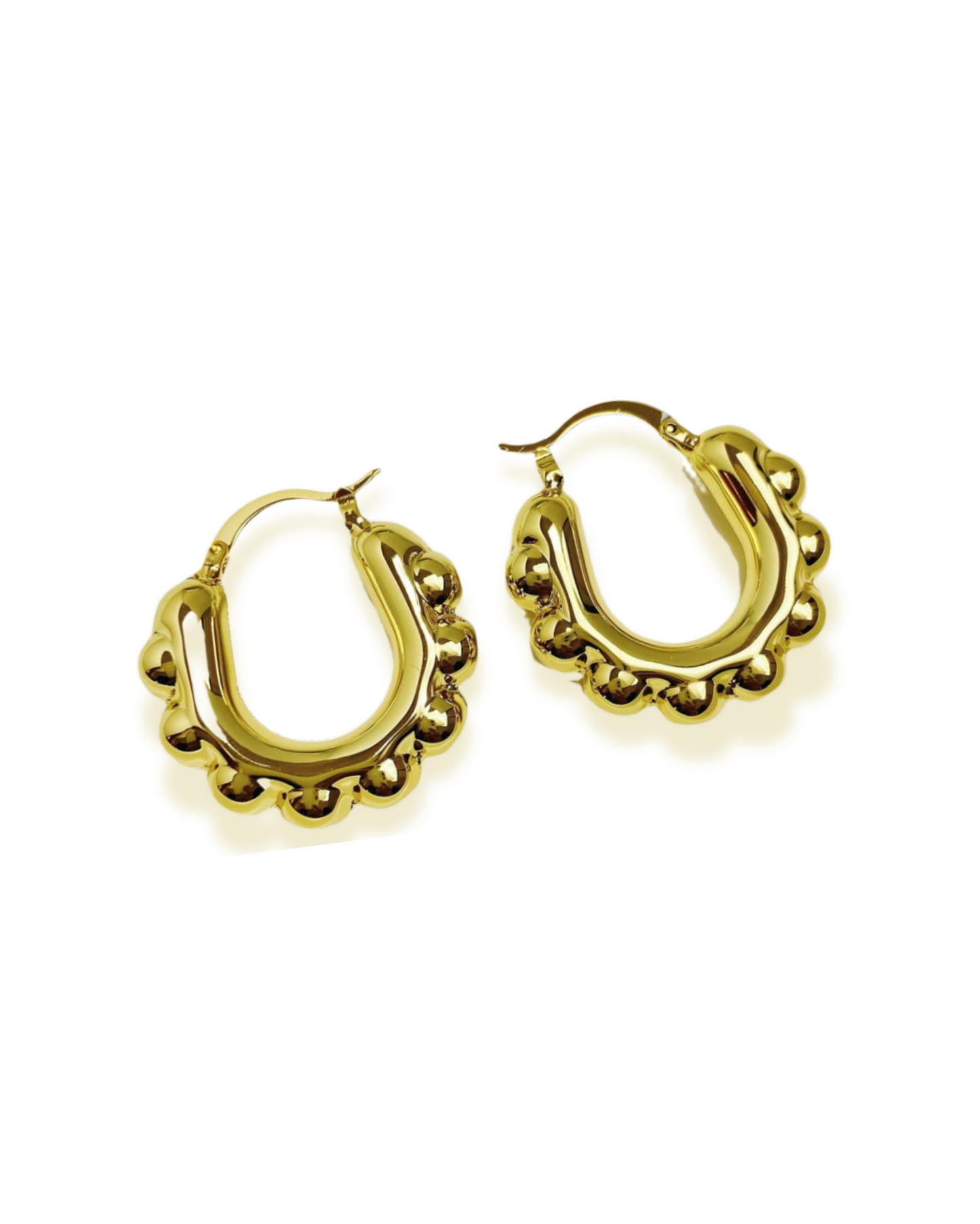 Gold hoop earrings on a white background